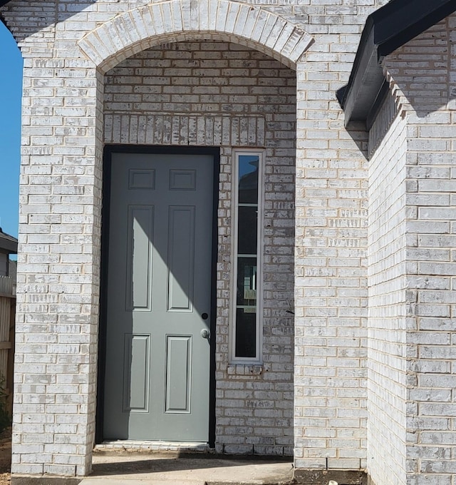 4314 Maple Root Ln, Pinehurst, TX 77362 - doorway to property featuring brick siding