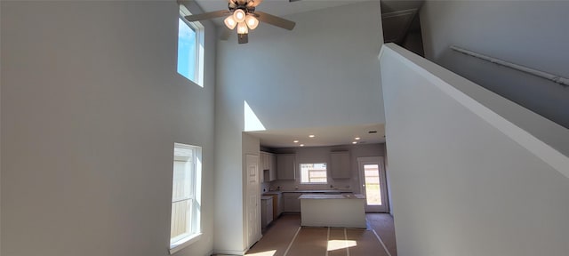4314 Maple Root Ln, Pinehurst, TX 77362 - corridor featuring a high ceiling and plenty of natural light