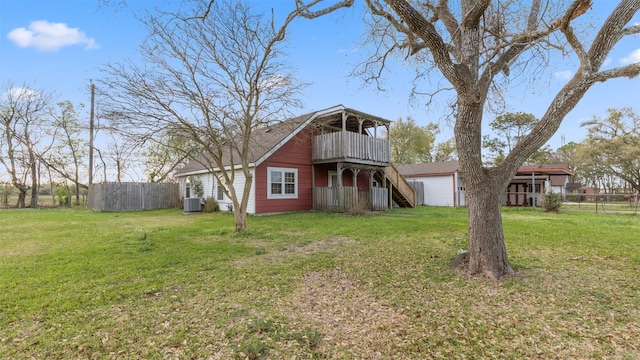 810 Robinson Rd, La Porte, TX 77571 - view of front of property with stairs, a front yard, cooling unit, and fence
