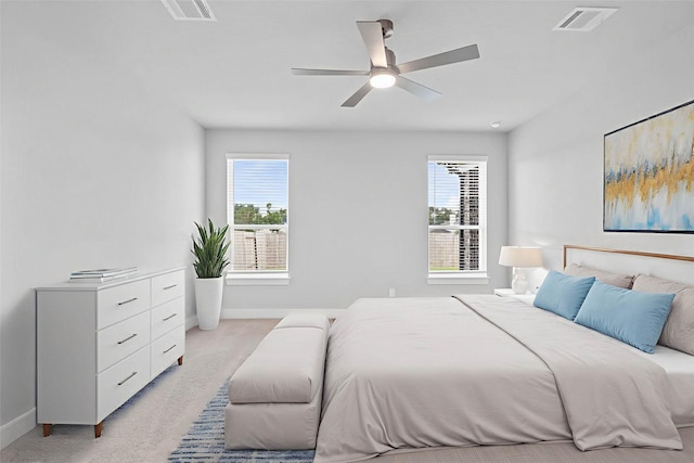 23507 Persimmon Creek Ln, Katy, TX 77493 - bedroom with multiple windows, light carpet, and a ceiling fan