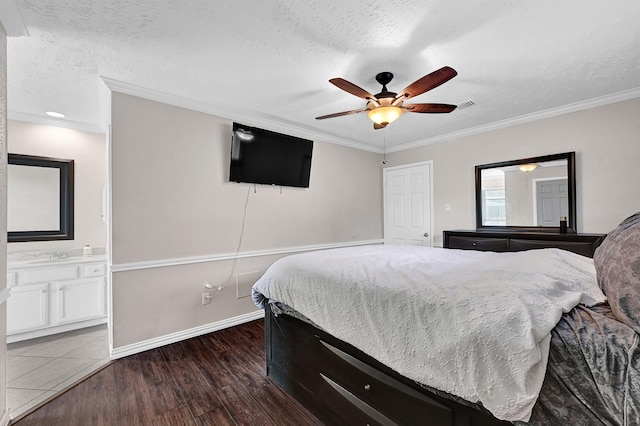 bedroom with visible vents, a textured ceiling, dark wood-style floors, and crown molding