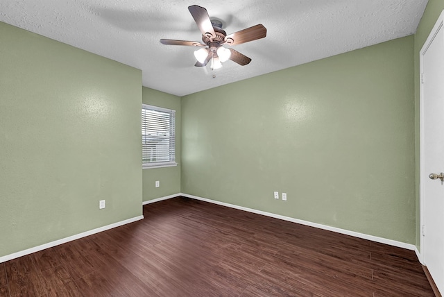 unfurnished room featuring wood finished floors, a ceiling fan, baseboards, and a textured ceiling