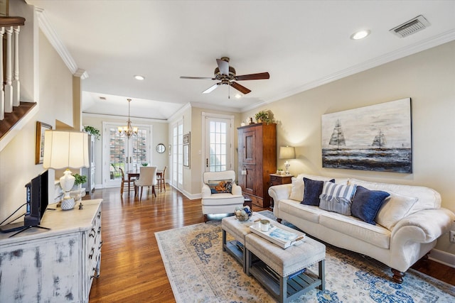 4106 Childress St, Houston, TX 77005 - living room with crown molding, wood finished floors, baseboards, and visible vents