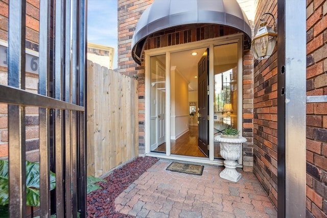 4106 Childress St, Houston, TX 77005 - doorway to property featuring brick siding and fence