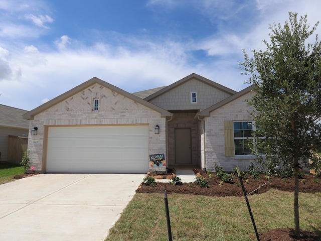 26239 Astral Way, La Marque, TX 77568 - view of front of property with an attached garage, driveway, and brick siding