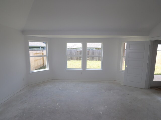 26239 Astral Way, La Marque, TX 77568 - empty room with concrete flooring and vaulted ceiling