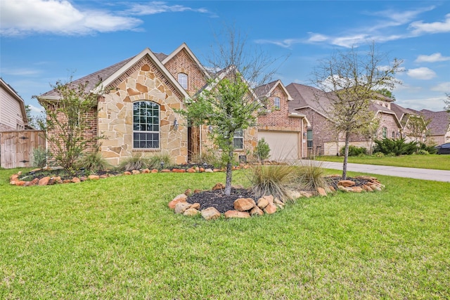 23509 Red Juniper Ln, New Caney, TX 77357 - view of front of house featuring stone siding, driveway, a garage, and brick siding