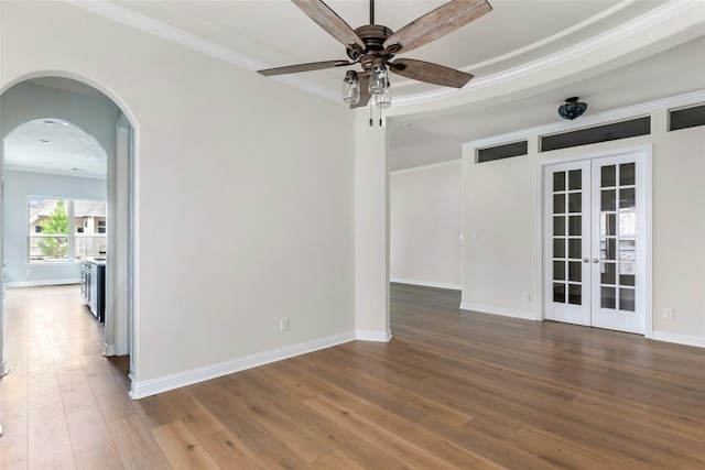 23509 Red Juniper Ln, New Caney, TX 77357 - unfurnished room featuring wood finished floors, french doors, a ceiling fan, and crown molding