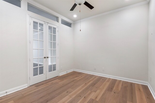 23509 Red Juniper Ln, New Caney, TX 77357 - spare room with french doors, a ceiling fan, crown molding, wood finished floors, and baseboards