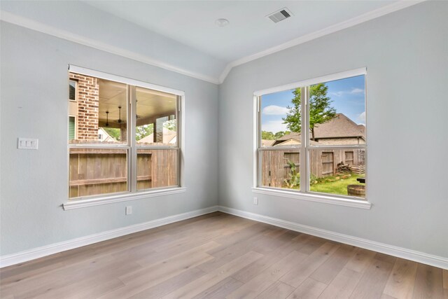 23509 Red Juniper Ln, New Caney, TX 77357 - unfurnished room with ornamental molding, baseboards, wood finished floors, and lofted ceiling