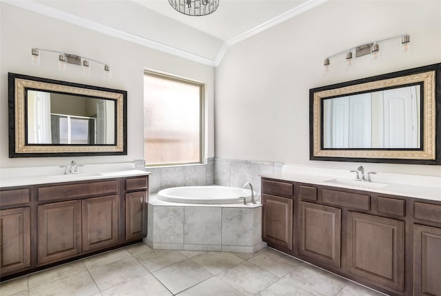 23509 Red Juniper Ln, New Caney, TX 77357 - bathroom featuring crown molding, two vanities, a garden tub, and tile patterned floors