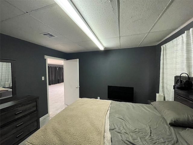 105 S 2nd St, Richmond, TX 77469 - bedroom featuring visible vents and a paneled ceiling