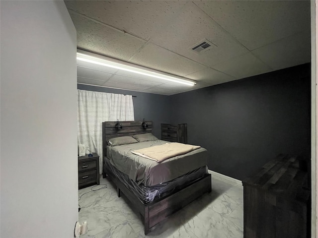 105 S 2nd St, Richmond, TX 77469 - bedroom with baseboards, visible vents, a paneled ceiling, and marble finish floor