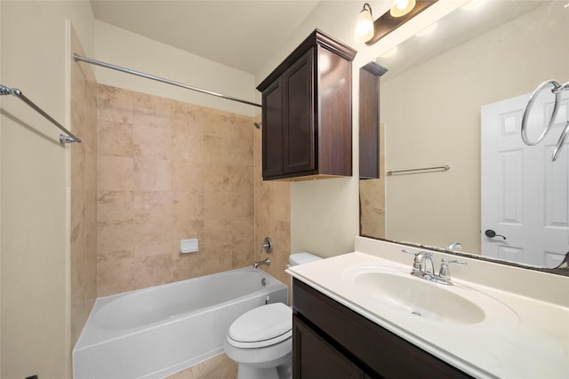 bathroom featuring toilet, vanity, and bathtub / shower combination
