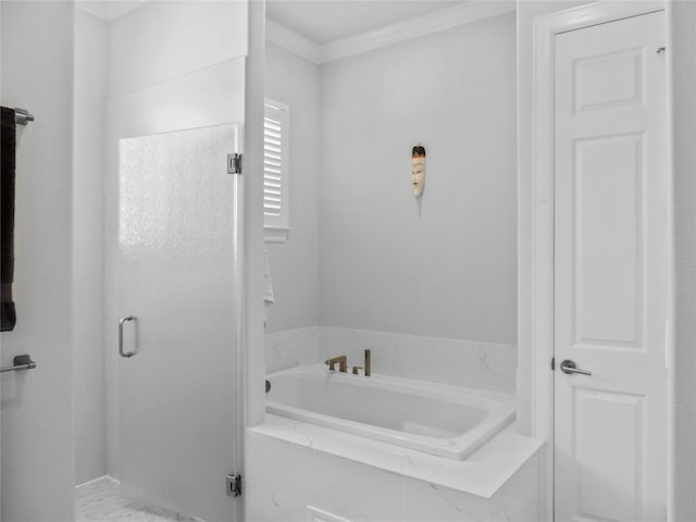 bathroom featuring crown molding and a bath