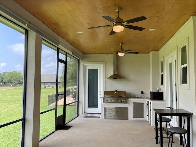 sunroom / solarium with a sink
