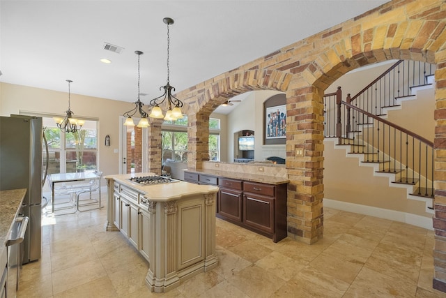 5206 Briarwick Meadow Ln, Sugar Land, TX 77479 - kitchen with appliances with stainless steel finishes, arched walkways, a chandelier, decorative light fixtures, and recessed lighting
