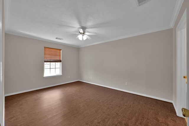 empty room with a ceiling fan, visible vents, and dark wood-style flooring