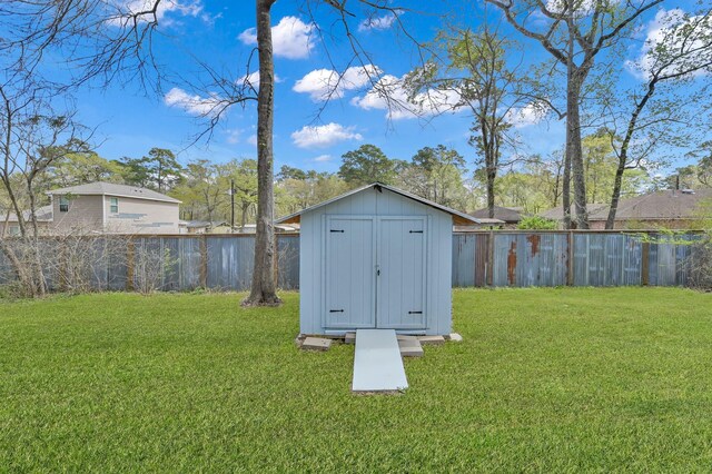 view of shed with a fenced backyard