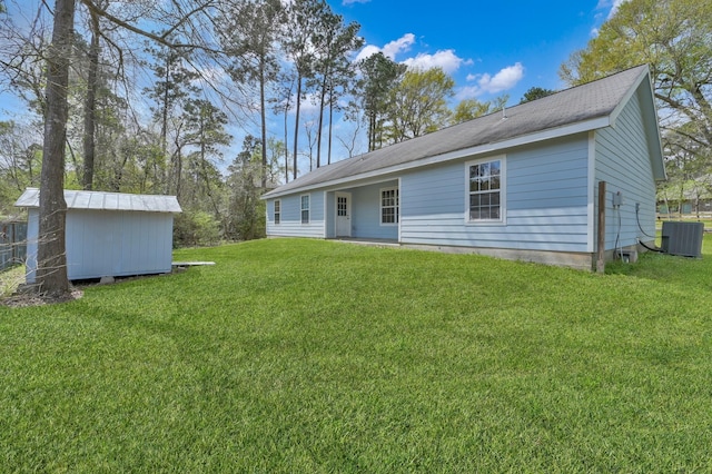 1015 Chickasaw Dr, Montgomery, TX 77316 - back of property featuring a yard and a shed