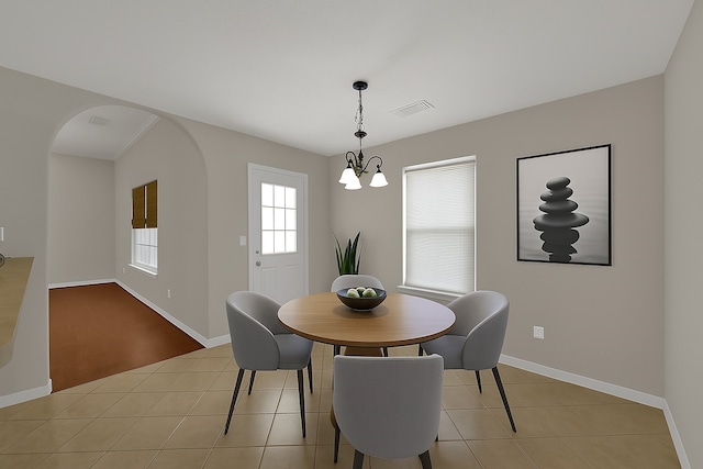 1015 Chickasaw Dr, Montgomery, TX 77316 - dining room with a chandelier, arched walkways, and light tile patterned floors