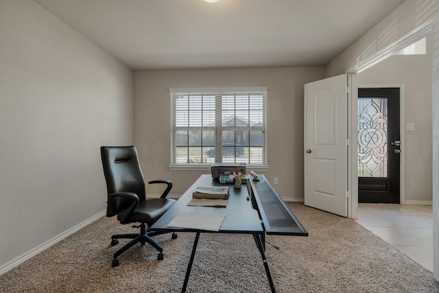 office area with light tile patterned flooring and baseboards