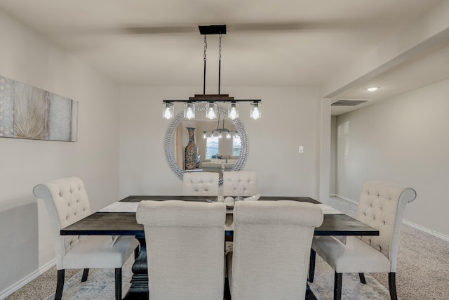 dining room featuring visible vents, baseboards, and carpet
