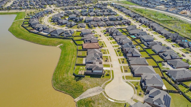 aerial view with a residential view and a water view