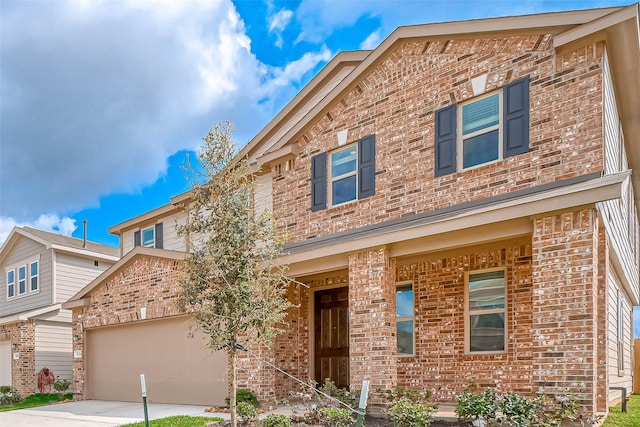 view of front of home with concrete driveway and brick siding