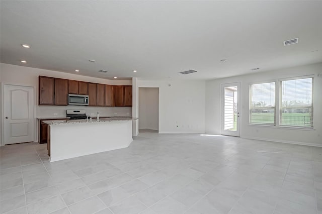 kitchen featuring visible vents, recessed lighting, appliances with stainless steel finishes, and open floor plan
