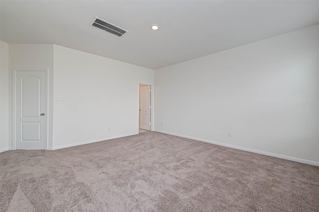 unfurnished room with visible vents, carpet flooring, and baseboards