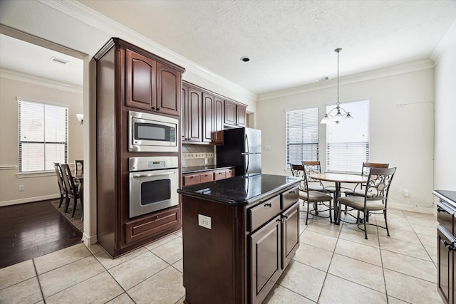 3031 Royal Oaks Grv, Houston, TX 77082 - kitchen with stainless steel appliances, ornamental molding, decorative light fixtures, baseboards, and a chandelier