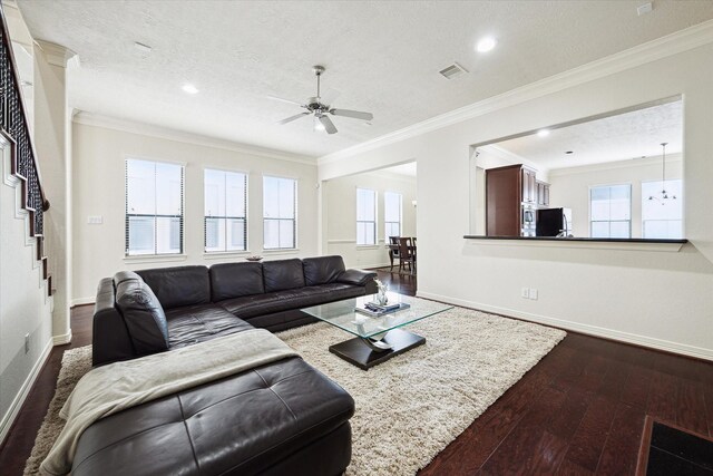 3031 Royal Oaks Grv, Houston, TX 77082 - living area with dark wood-style flooring, ceiling fan, baseboards, ornamental molding, and healthy amount of natural light