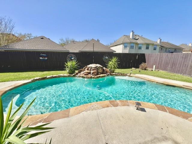 view of swimming pool with a fenced in pool and a fenced backyard