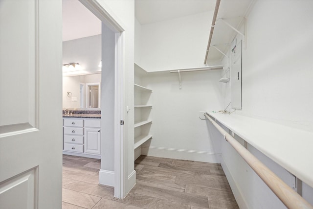 spacious closet with a sink