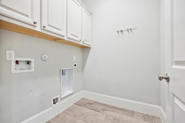 laundry room with baseboards, washer hookup, hookup for a gas dryer, cabinet space, and electric dryer hookup