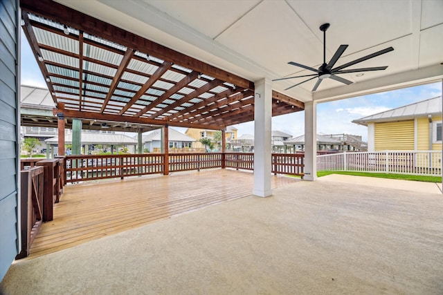 view of patio / terrace featuring ceiling fan and fence