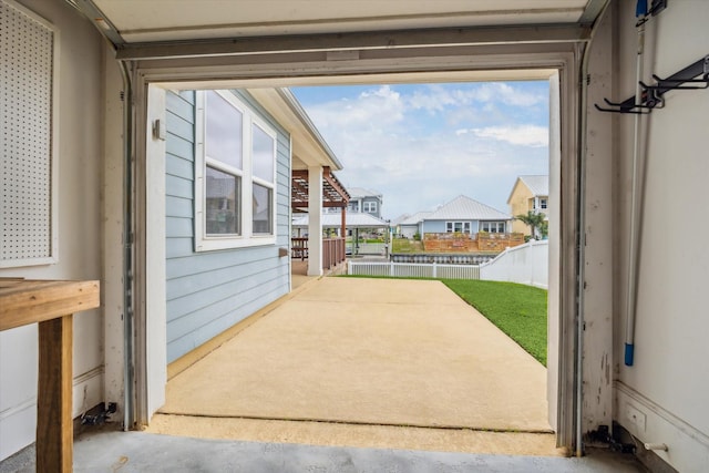 view of patio / terrace with a residential view and fence