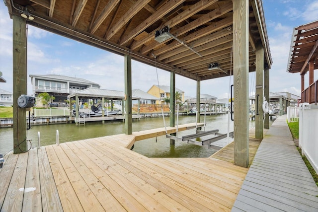 view of dock featuring a water view and boat lift
