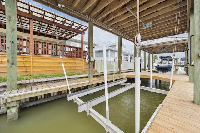 dock area featuring a water view and boat lift