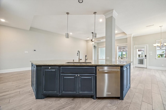 kitchen featuring light stone countertops, an island with sink, a sink, stainless steel dishwasher, and ceiling fan with notable chandelier