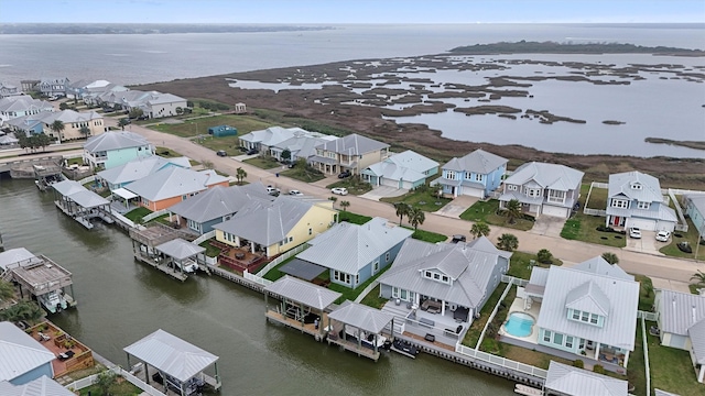 bird's eye view with a residential view and a water view