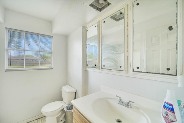 bathroom with toilet and vanity