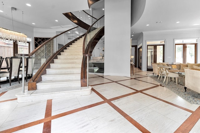 2247 Bartlett St, Houston, TX 77098 - staircase with ornamental molding, inlaid floor details, recessed lighting, and baseboards