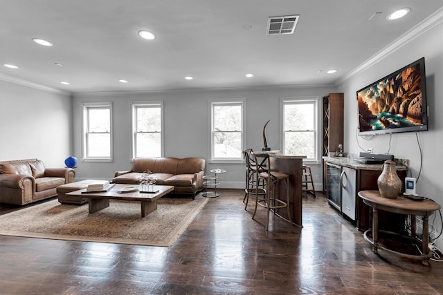 2247 Bartlett St, Houston, TX 77098 - living area with plenty of natural light, crown molding, recessed lighting, baseboards, and dark wood finished floors