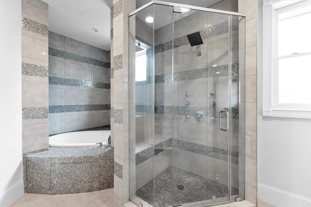 2247 Bartlett St, Houston, TX 77098 - full bathroom featuring plenty of natural light, a bath, and baseboards