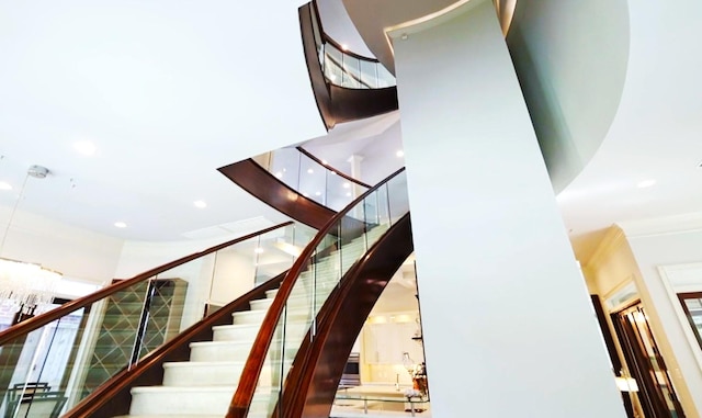 2247 Bartlett St, Houston, TX 77098 - stairs with a towering ceiling, recessed lighting, and ornamental molding