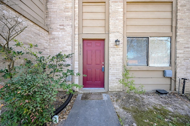 6514 Kentwick Dr, Houston, TX 77084 - view of exterior entry featuring brick siding