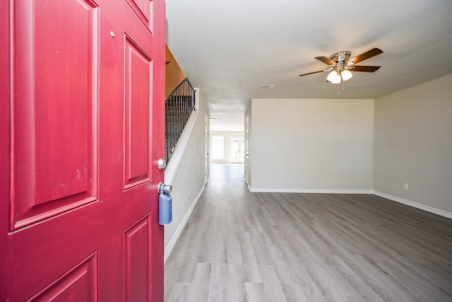 6514 Kentwick Dr, Houston, TX 77084 - foyer entrance with light wood-type flooring, baseboards, a ceiling fan, and visible vents
