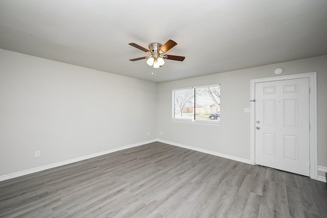 6514 Kentwick Dr, Houston, TX 77084 - spare room featuring baseboards, a ceiling fan, and wood finished floors